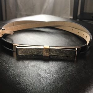 Leather belt with metal bow